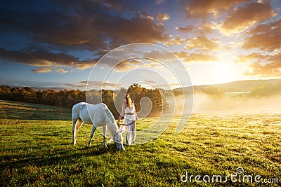 Beautiful sensual women with white horse Stock Photo