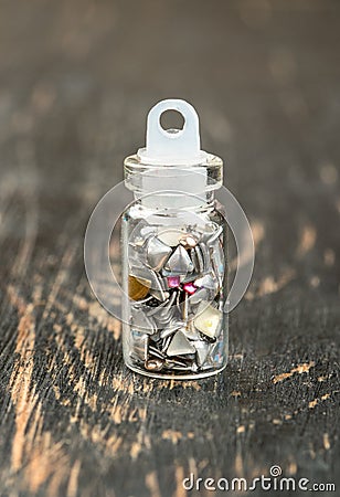 Beautiful sequins in a tiny bottle Stock Photo