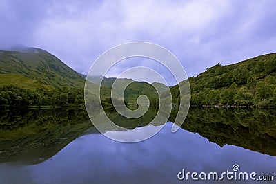 Beautiful and serene landscape of a lake and mountains in the Highlands of Scotland, United Kingdom Stock Photo