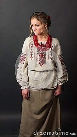 Beautiful serious young woman in Ukrainian embroidery Stock Photo