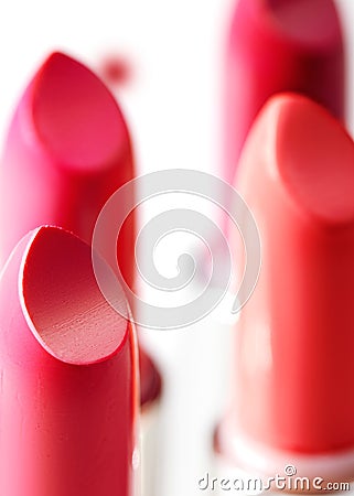 Beautiful set of lipsticks in red colors. Beauty cosmetic collection. Fashion trends in cosmetics with bright lips Stock Photo