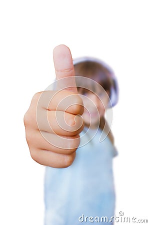 A beautiful seven-year-old girl shows a thumb up on a white background Stock Photo