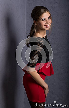 Beautiful brunette girl in red short skirt Stock Photo