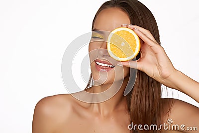 Beautiful brunette woman with citrus on a white background, healthy food, tasty food, organic diet, smile healthy Stock Photo