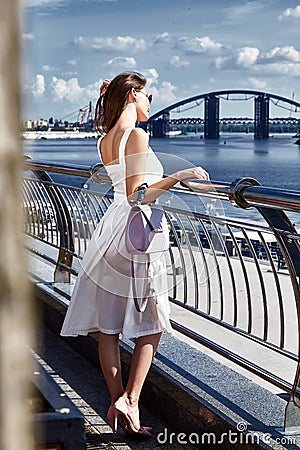 Beautiful brunette woman walk on the street summer time wea Stock Photo