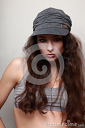 Beautiful female model in trendy cap Stock Photo