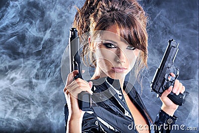 Beautiful girl holding gun Stock Photo