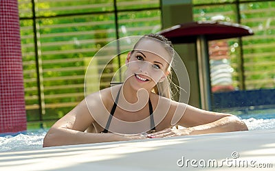 Beautiful Woman Relaxing In Swimming Pool. Stock Photo