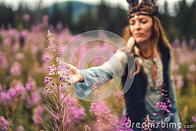 beautiful shamanic woman with headband in the nature. Stock Photo