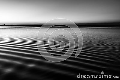 Beautiful and sharp water ripples on Trasimeno lake Umbria, Italy at dusk Stock Photo