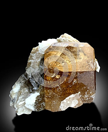 beautiful sherry color natural topaz crystal with muscovite mineral specimen from skardu Pakistan Stock Photo