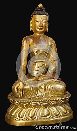 Beautiful shining classical Buddha Shakyamuni. Siddhartha Gautama. Golden statue with open eyes isolated on the black Stock Photo