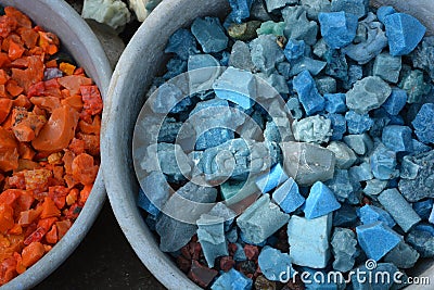 Beautiful colorful stones in clay vessels background Stock Photo