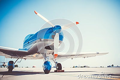 Beautiful shiny sport plane standing on airport Stock Photo