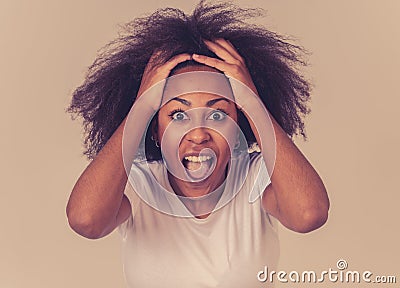 Portrait of surprised and happy african american woman looking at something too good to believe Stock Photo