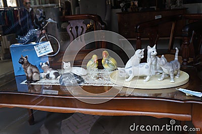 Beautiful shop window with porcelain sculptures Editorial Stock Photo