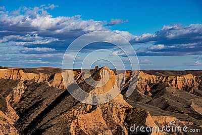 Beautiful shot of brown stone formations under a cloudy bright sky Stock Photo