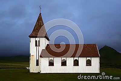 Beautiful shot of the Hellnar Church in a field in Iceland on a cloudy day Stock Photo