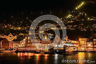 Beautiful shot of illuminated traditional buildings onshore in Bergen, Norway Editorial Stock Photo