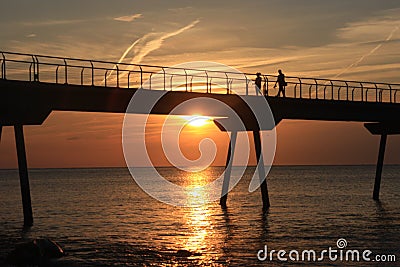 Beautiful shot of the Pont Del Petroli in Spain on an orange sunset background Stock Photo