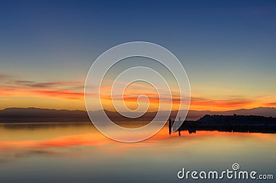 Beautiful shot of the reflection of the orange sunset sky in the water Stock Photo