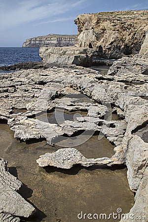 Beautiful shot of stunning rocky landscape surrounding Dwejra Bay, Malta Stock Photo