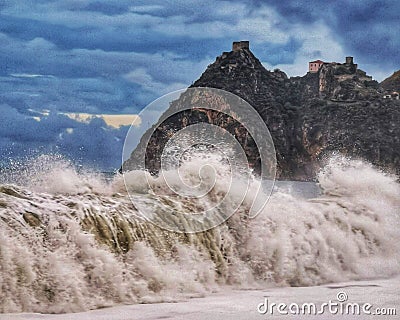 Beautiful shot of wav by the ocean on a cloudy day Stock Photo