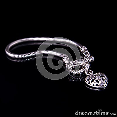 Beautiful silver bracelet on black background Stock Photo