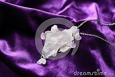 Beautiful silver pendent with pure quartz and amethyst gemstones Stock Photo