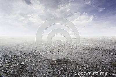 Beautiful simple gravel background with mist and clouds Stock Photo