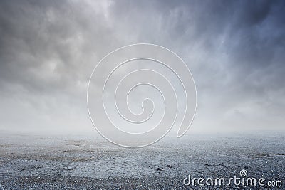 Beautiful simple gravel background with mist and clouds Stock Photo