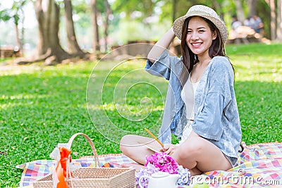 Beautiful single women girl teen enjoy relax holiday picnic outdoor at green park alone Stock Photo