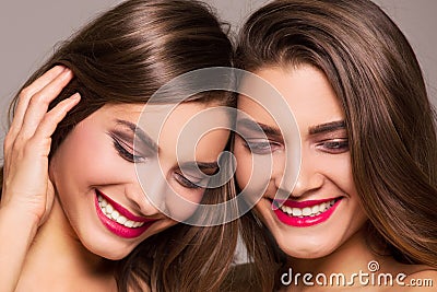 Beautiful sister twins with amazing smile. Stock Photo