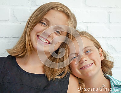 Beautiful sisters in affectionate pose Stock Photo