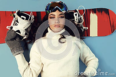 Beautiful skier girl with dark hair wears ski equipment Stock Photo