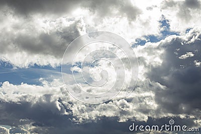 Beautiful sky landscape with dramatic clouds and bright sunspots Stock Photo