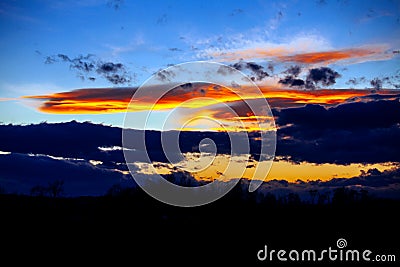 Beautiful sky twilight time sunset clouds orange blue yellow mood peace calm peaceful landscape Stock Photo