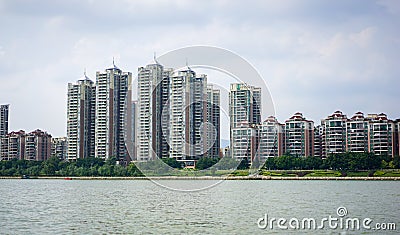 A beautiful skyline view of a typical apartments in China by the river Stock Photo