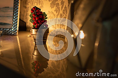 Beautiful and small Christmas tree on a reflective surface Stock Photo