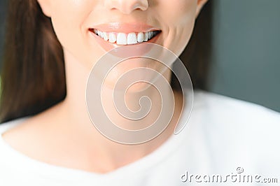 Beautiful Smile With White Teeth. Closeup Of Smiling Woman Mouth With Natural Plump Full Lips And Healthy Perfect Smile Stock Photo