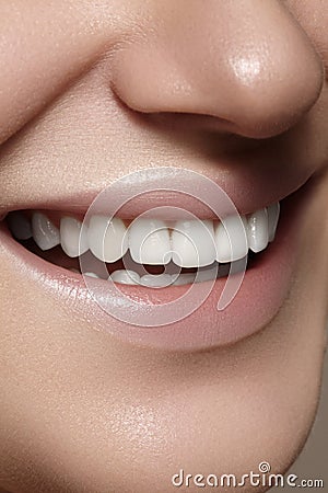 Beautiful smile with whitening teeth. Dental photo. Macro closeup of perfect female mouth, lipscare rutine Stock Photo