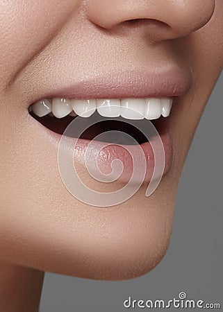 Beautiful smile with whitening teeth. Dental photo. Macro closeup of perfect female mouth, lipscare rutine Stock Photo