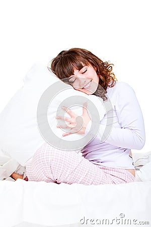 Beautiful smiley woman with pillow Stock Photo