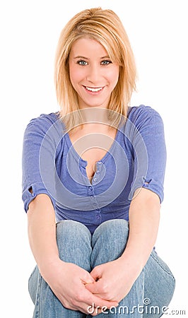 Beautiful Smiling Blonde Sitting Down and Relaxing Stock Photo