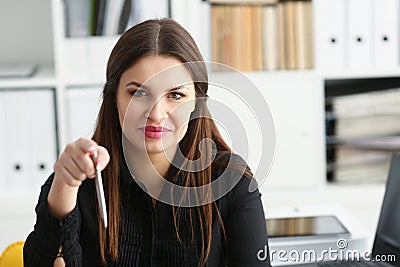 Beautiful smiling clerk girl at workplace talk to visitor Stock Photo