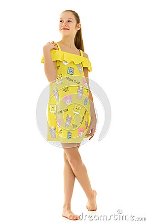 Beautiful Smiling Teenage Girl in Yellow Short Cotton Dress Posi Stock Photo