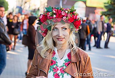 Beautiful smiling Ukrainian woman wearing flower wreath Editorial Stock Photo