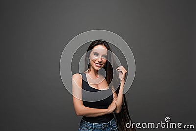 Beautiful smiling woman with clean skin, natural make-up, and white teeth with bright smile and beautiful long hair looking happil Stock Photo