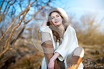 Beautiful smiling woman relaxing outdoors Stock Photo