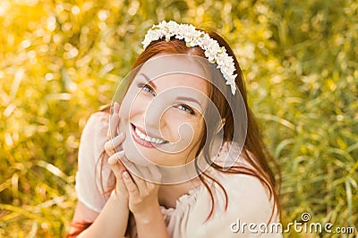 Beautiful smiling woman with spring flowers Stock Photo